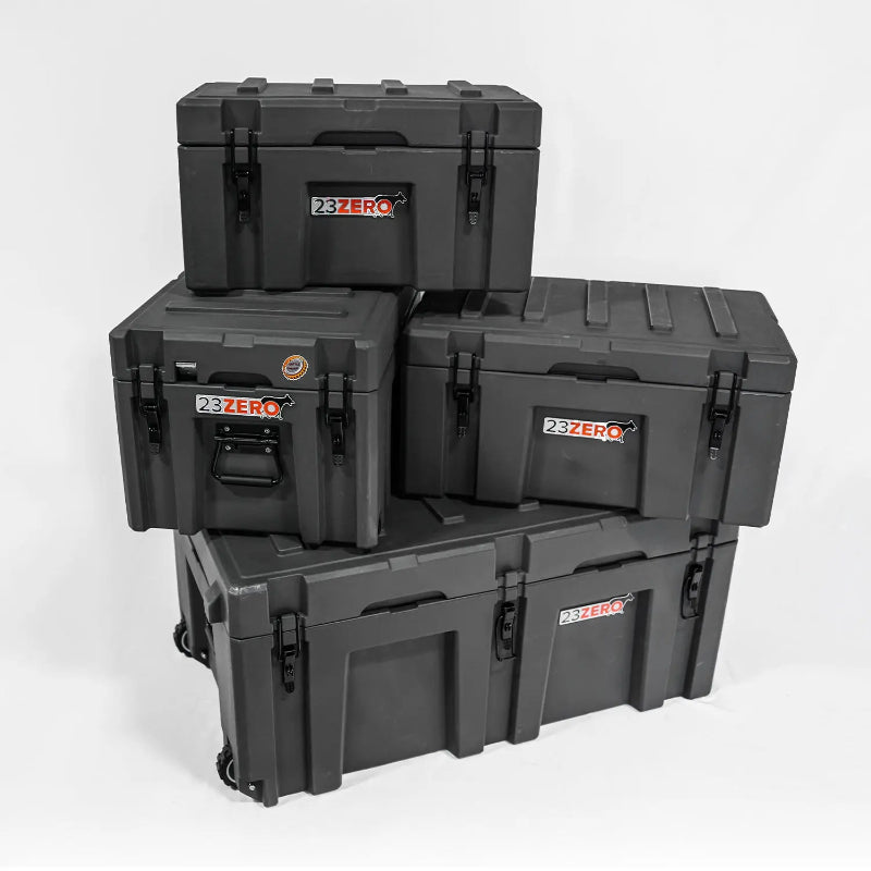 Image of a stack of four grey 23ZERO storage boxes of varying sizes, with the largest at the bottom having wheels, angled front and side view on a white background.