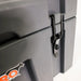 Image of a close-up of a black latch on a grey 23ZERO storage box, angled side view on a white background.