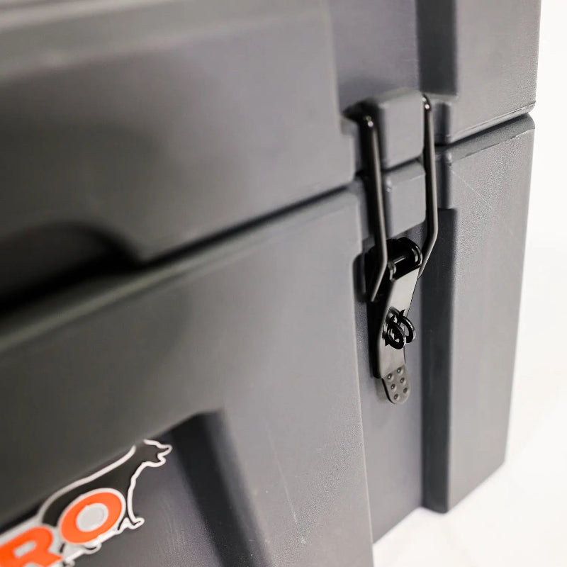 Image of a close-up of a black latch on a grey 23ZERO storage box, angled side view on a white background.