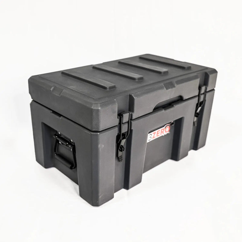 Image of a closed grey 23ZERO storage box with black latches and side handles, angled front and side view on a white background.