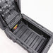 Image of an open dark gray storage box, revealing the spacious interior with a ribbed bottom and supported by gas struts, angled top view on a white background.