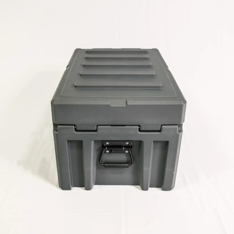 Image of a closed grey storage box with a black side handle, front view on a white background.