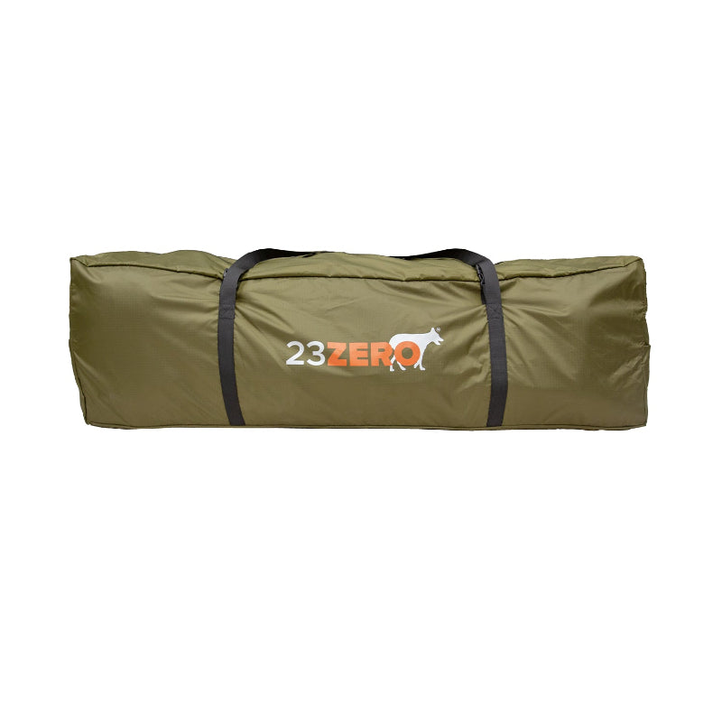 Image of the 23ZERO Armadillo A2 Plus rooftop tent annex room packed and zipped inside its long, olive-green bag with black carrying straps. The 23ZERO logo is visible on the side of the bag in orange lettering