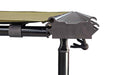Close-up image focusing on the corner mechanism of a Peregrine Awning, showing the green fabric attached to a black support frame and pole. The intricate dark metal joint is clearly visible against a white background