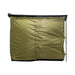 Image of a fully enclosed Bushman awning room, showing its solid green fabric side with all window flaps zipped shut. The room is presented from a direct side view on a white background