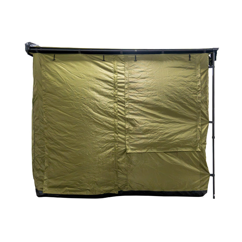 Image of a fully enclosed Bushman awning room, showing its solid green fabric side with all window flaps zipped shut. The room is presented from a direct side view on a white background