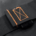 Image showing a close-up of a black fabric strap with reinforced orange stitching, resembling a rectangular box, over another black fabric surface.