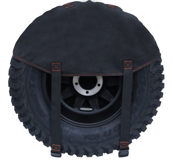 Image of a black 23ZERO spare tire cover on an off-road tire with a black rim, shown from a front view on a white background.