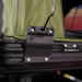 Image of black steel awning window pole mount bracket installed on roof rack with bolts secured, close-up angled side view.