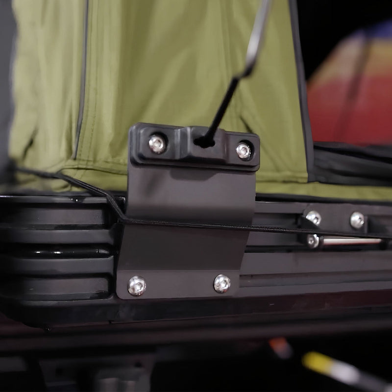 Image of black steel awning window pole mount bracket installed on roof rack with bolts secured, close-up angled side view.