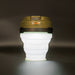Image of 23ZERO LED solar tent light with collapsible white silicone body and olive green top, front view on dark background.