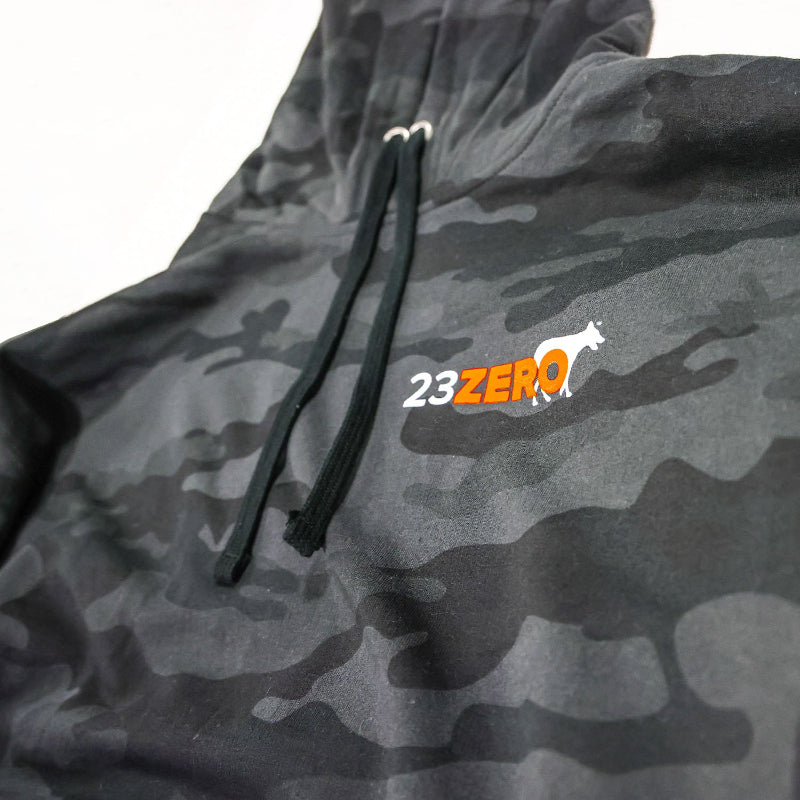 Image of 23ZERO black camo pullover hoodie with drawstring hood and chest logo detail, close-up angled front view on white background.