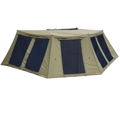 Image of the 23ZERO Peregrine 270 Deluxe Wall Set for an awning, fully set up. The walls are a khaki color with large black mesh windows and a zippered door. The awning wall is shown from a front-and-side view against a simple gray background