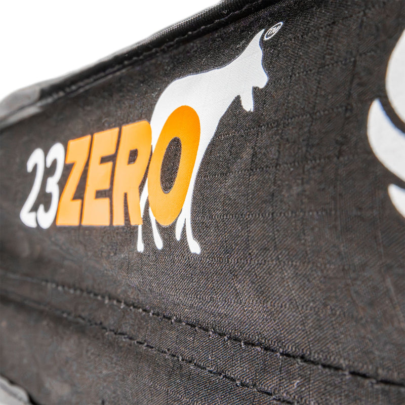 Image of a close-up detail of the 23ZERO brand logo printed directly onto the black fabric of the Peregrine PRO 180 Awning's carrying case. The logo features "23ZERO" in white and orange text with a stylized white wolf