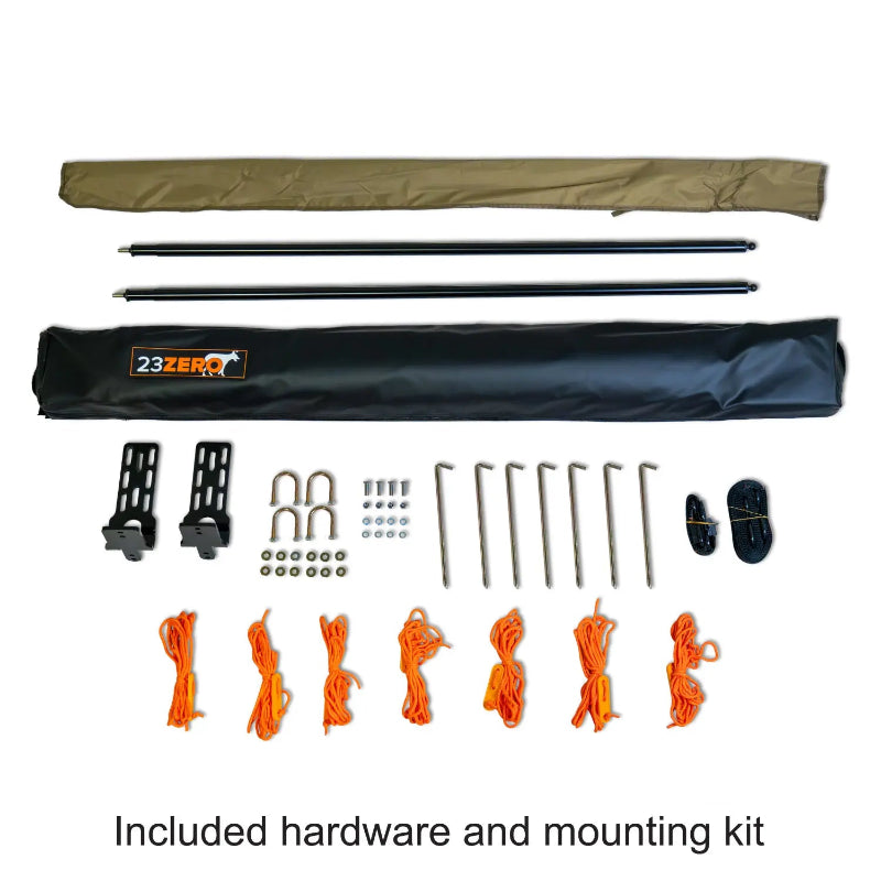 Image of the full hardware and mounting kit for a 23ZERO Peregrine Awning, laid out on a white background. The kit includes a black carrying bag, two long poles, various brackets and nuts, multiple stakes, and a pile of bright orange ropes