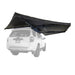 Image of 23Zero Peregrine Pro 270° 5-arm awning fully deployed, black fabric with black underside, mounted on the side of a white vehicle, rear and low-angle view with a clear background