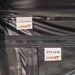 Close-up image of two labels on dark fabric, one reading '270 RIGHT WALL 2' and the other '270 W-B', both with the '23ZERO' logo, next to a black zipper
