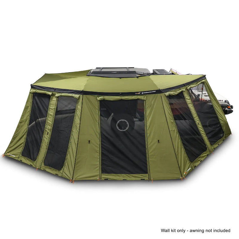 Image of the OVS Peregrine Pro 270-degree awning walls fully deployed, creating a large olive green enclosed room, attached to a vehicle with a note 'Wall kit only - awning not included' at the bottom, all on a white background