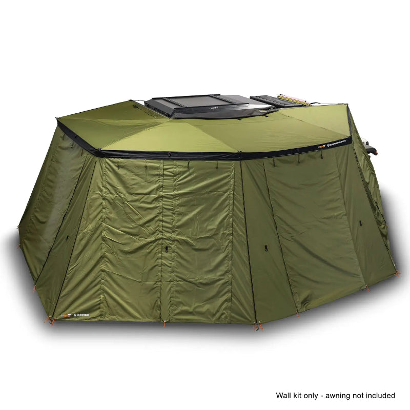 Image of the OVS Peregrine Pro 270-degree awning with all solid olive green walls deployed, creating a fully enclosed shelter attached to a vehicle, with a note 'Wall kit only - awning not included' at the bottom, all on a white background