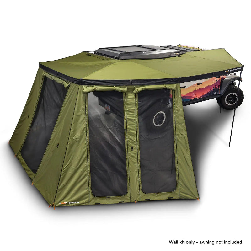 Image of an OVS Peregrine Pro 270-degree awning with olive green walls, featuring large clear windows and mesh panels, fully deployed and attached to an off-road trailer, with a note 'Wall kit only - awning not included' at the bottom, all on a white background