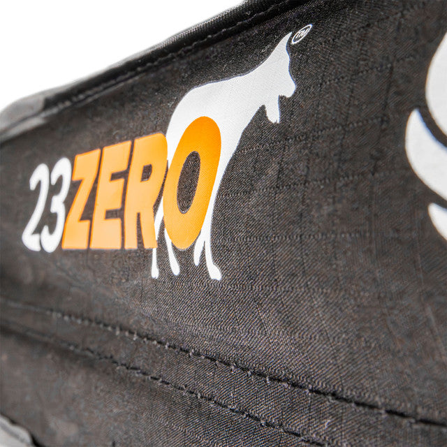 Close-up image of 23ZERO logo on Peregrine Pro 5-arm awning cover, black fabric with orange logo, detailed shot on a textured background