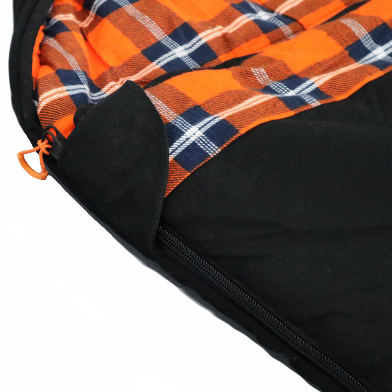 Image of a black sleeping bag with an orange, blue, and white plaid flannel interior, featuring an open zipper with an orange pull tab.