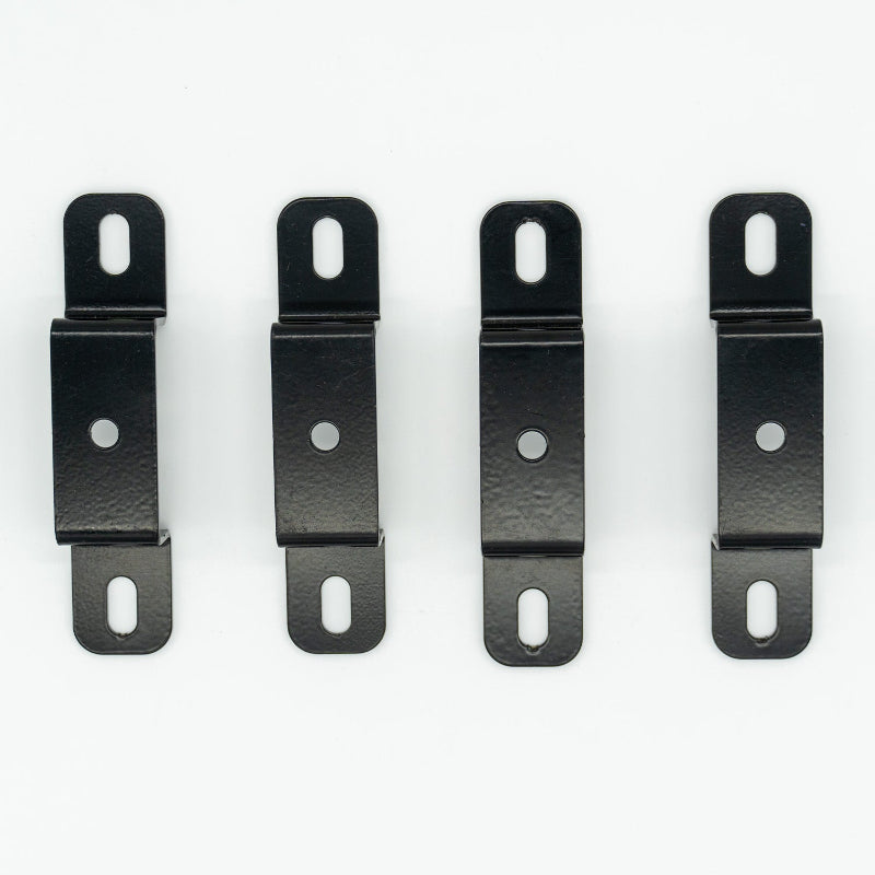 Image of four black powder-coated steel mounting brackets with slotted end holes and center round holes, top-down view aligned vertically on white background.