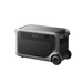 Image of Anker SOLIX F3000 portable power station featuring rear panel with ventilation grills and rugged gray casing with dual wheels, compact rectangular body, angled rear and side view on transparent background
