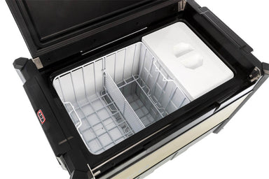Image of ARB Zero Fridge Freezer with lid open, showcasing a spacious interior with a white divider and metal wire baskets, angled top-down view on a white background.