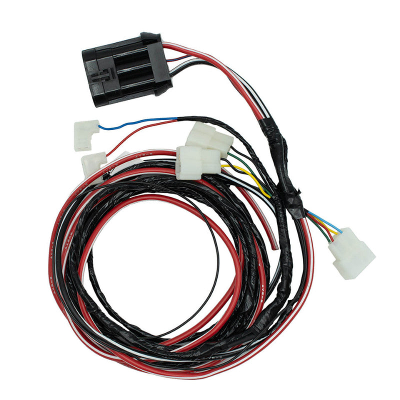 Image of a coiled wiring harness with black, red, and white wires, featuring a large black connector and several white connectors, on a white background
