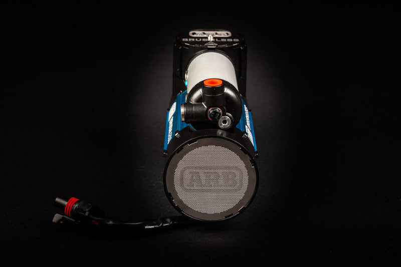 Image of an ARB Brushless 12V Air Compressor, blue and silver, viewed from the front on a black background, showcasing the intake grill