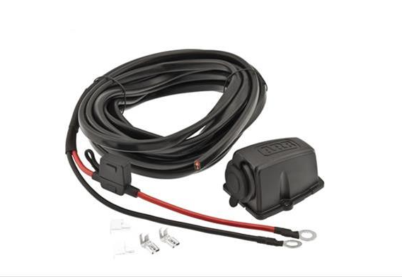 Image of ARB fridge wiring kit with coiled power cable, fused connector, black control module, and mounting hardware, front angled view on white background.