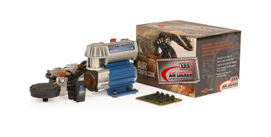 Image of an ARB Air Locker Air Compressor with a blue motor and silver head, along with its brown and red packaging box and various components, all on a white background.