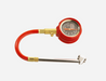 Image of ARB small dial tire pressure gauge with red rubber housing, flexible red hose and metal chuck fitting, angled front view on white background.