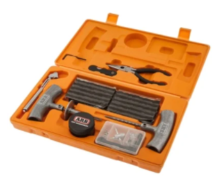 Image of ARB Speedy Seal tire repair kit in orange hard case with plugs, tools, and accessories neatly arranged, open case front view on white background.