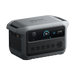 Image of Anker SOLIX portable power station with digital LCD display, multiple AC outlets and side ports, rugged gray casing, angled front and side view on black background.