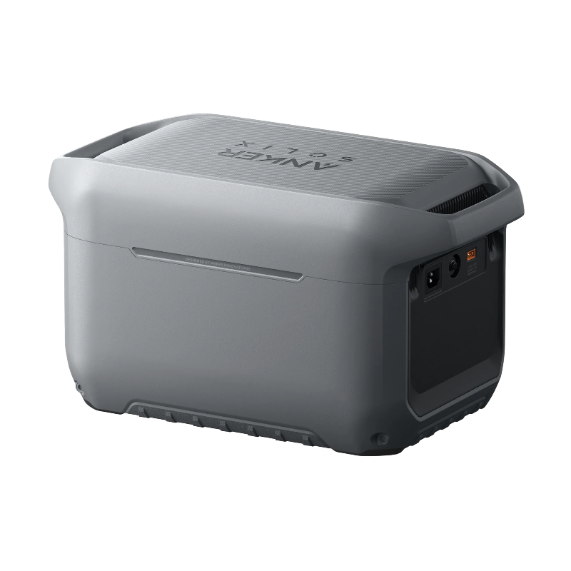 Image of Anker SOLIX portable power station with smooth gray rear casing and visible side input ports, durable compact design, angled rear and side view on black background.
