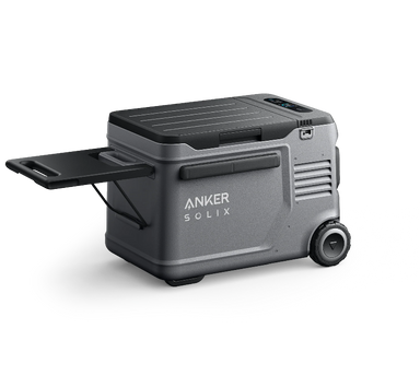 Image of Anker SOLIX portable electric cooler with slide-out tray, rugged gray body and built-in wheels, angled side and rear view on black background.