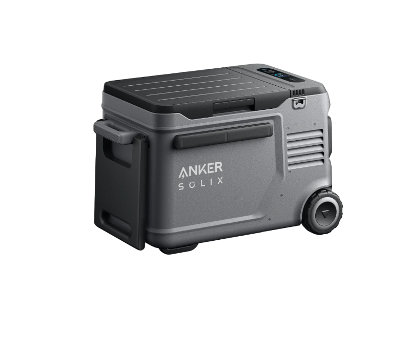 Image of Anker SOLIX portable electric cooler with rugged gray body, pull-out side tray and built-in wheels, angled front and side view on black background.