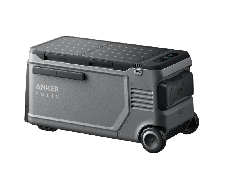 Image of Anker SOLIX EverFrost electric cooler with durable gray casing, closed dual lid, side battery compartment, wheels and handle visible, angled rear and side view on transparent background.