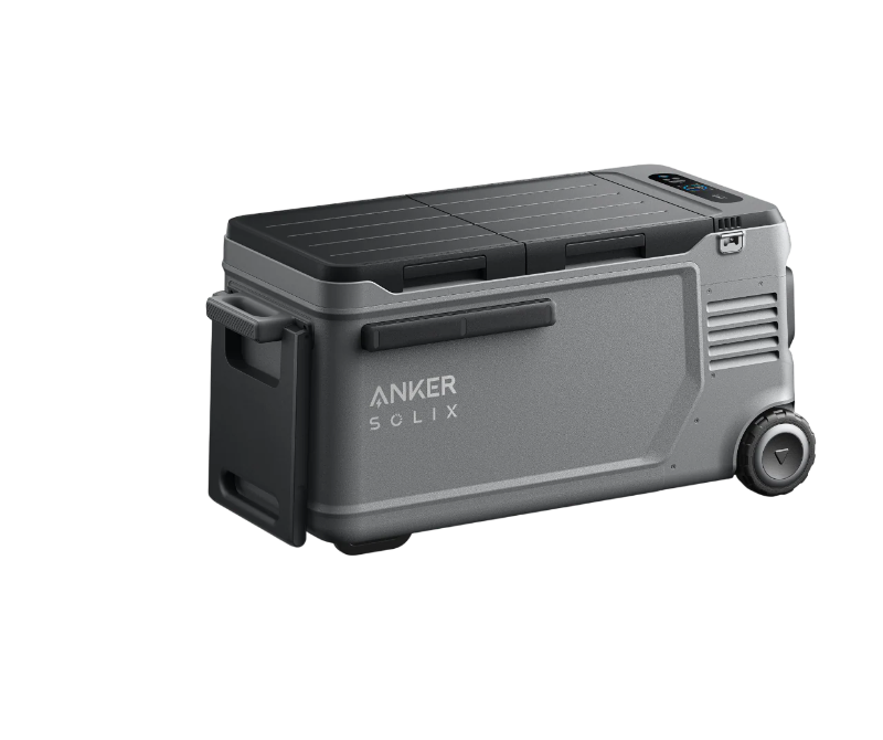 Image of Anker SOLIX EverFrost electric cooler with rugged gray exterior, closed lid, side handles and large wheels, angled front and side view on transparent background.