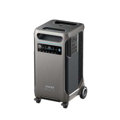 Image of Anker SOLIX portable power station with tall gray housing, digital display panel, top carry handles and wheels, angled front and side view on transparent background.