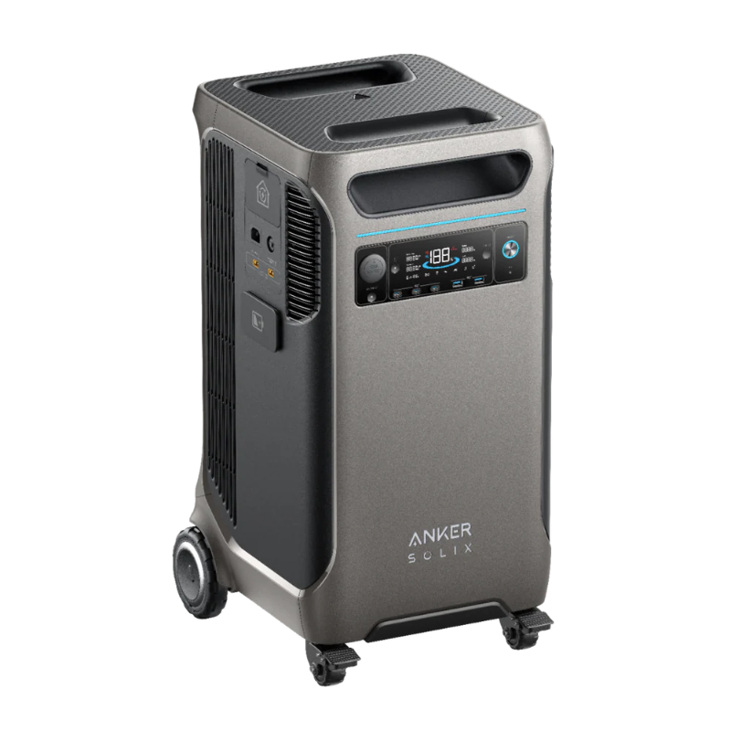 Image of Anker SOLIX portable power station with metallic gray housing, front digital display, side ports and vents, top carry handles and wheels, angled front and side view on transparent background.