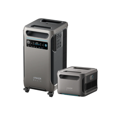 Image of Anker SOLIX portable power station with matching expansion battery, metallic gray housings, digital display and vents visible, angled front and side view on transparent background.