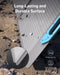 Image of Anker SOLIX portable solar panel demonstrating durable, scratch-resistant surface with protective fluorine coating, black photovoltaic panel with blue handle, close-up angled view on outdoor ground background.