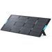 Image of Anker SOLIX portable solar panel fully deployed with integrated kickstand and blue carry handles, large black photovoltaic surface, angled front and side view on black background.