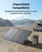 Image of Anker SOLIX portable solar panel connected to a power station in a desert landscape, foldable black panel with blue handles and angled stand, wide front and side view in outdoor camping setting.