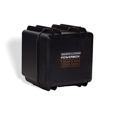 Image of a black Dakota Lithium Powerbox 135, angled front and side view, on a light gray background