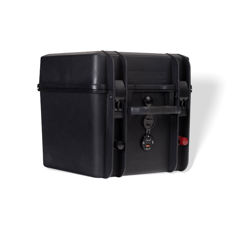 Image of a black Dakota Lithium Powerbox 60 with a waterproof battery, angled front and side view, on a light gray background