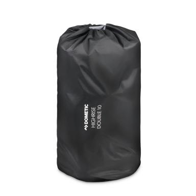 Image of a black Dometic High-Rise Double 10 sleeping pad rolled and stored in its black drawstring carry bag, on a light gray background.